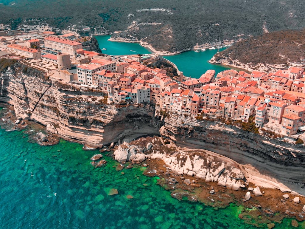 Explore the stunning cliffside village of Bonifacio, Corsica, with its dramatic coastal views.