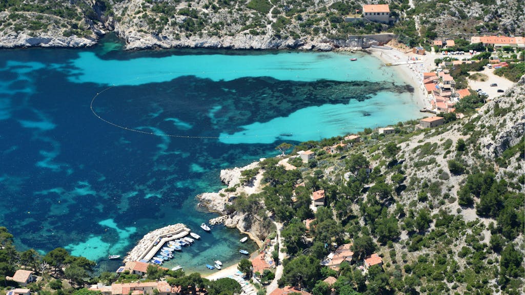 Stunning aerial view of Calanques coastline with turquoise waters and natural beauty in Marseille, France.