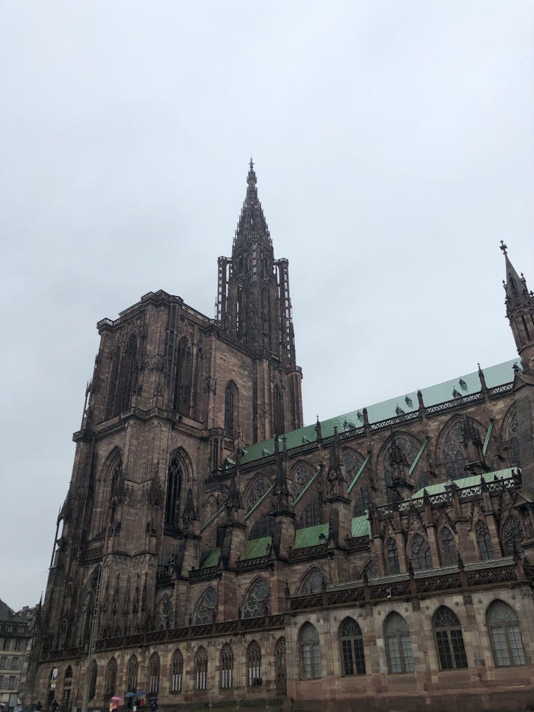 Low angle view of the historic Strasbourg Cathedral, showcasing its stunning Gothic architecture.